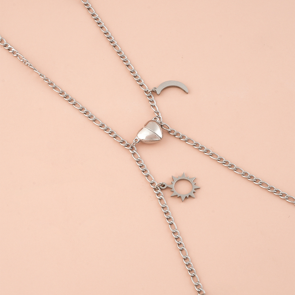 Coppia Bracciali in acciaio con ciondolo (mezzo cuore magnetico)